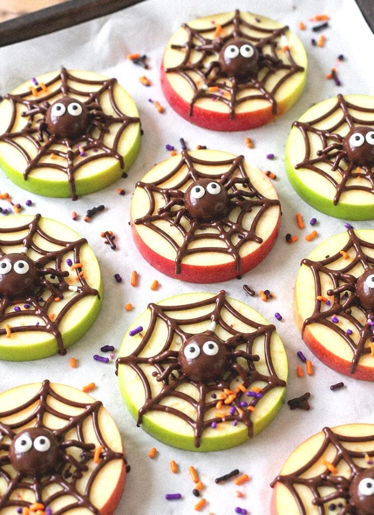 Halloween Apple Slices with a Chocolate Spiderweb