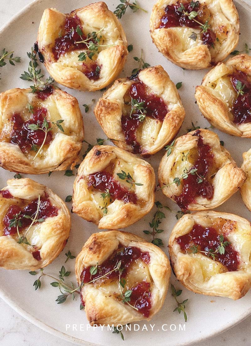 Buttery Puff Pastry Cups Filled With Brie and Cranberry Sauce
